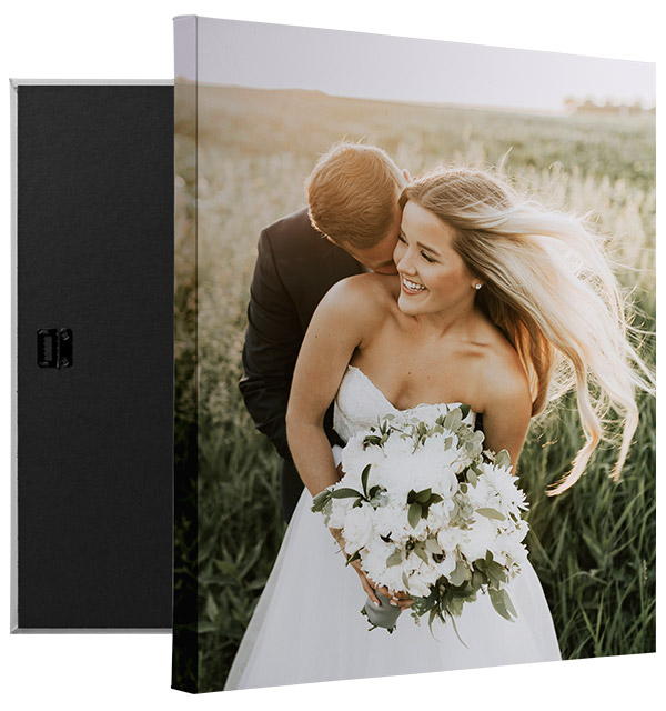 canvas print of a happy couple in wedding attire